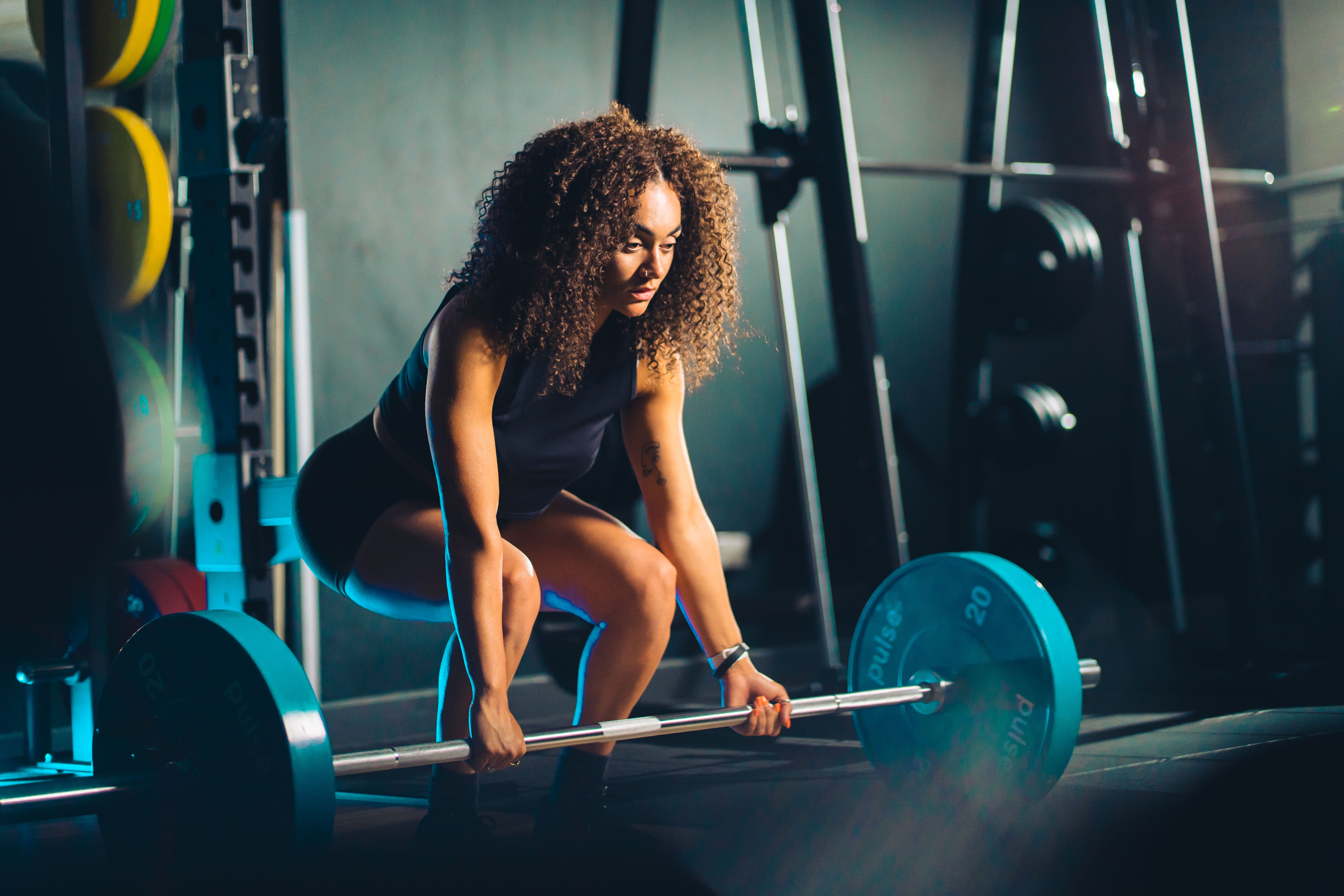 Woman training in the ladies gym at M Club