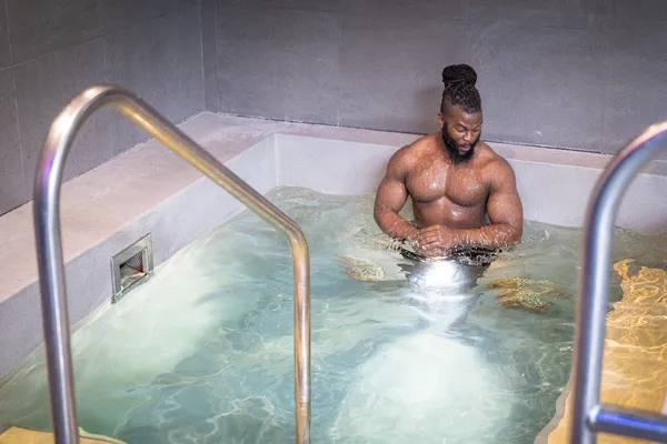 Member using the hydrotherapy pool